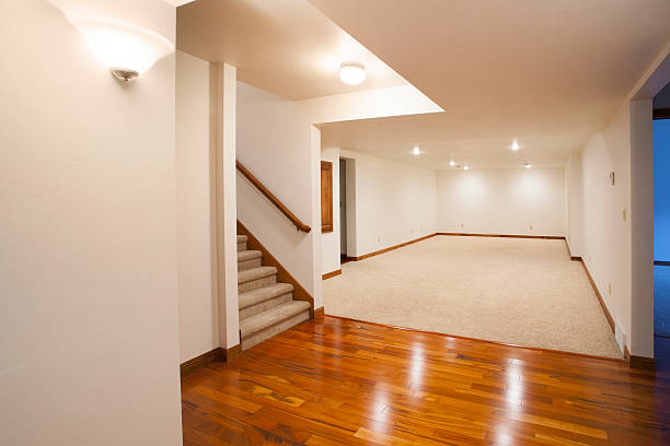 Basement finishing with drywall, flooring, and lighting installation